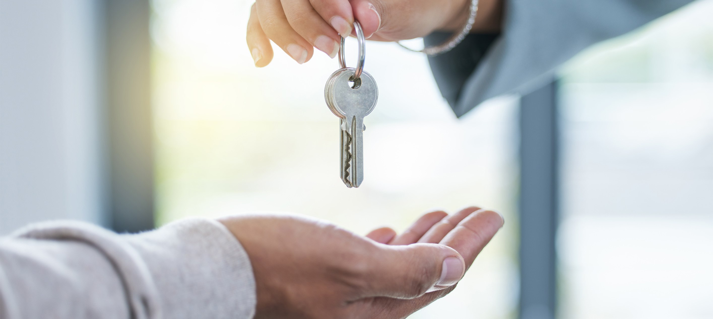 A home key being handed to a Middle Tennessee buyer