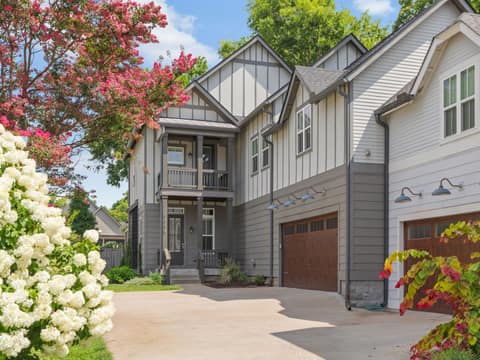 Porch life, privacy, and a two-car garage. Features everyone wants!